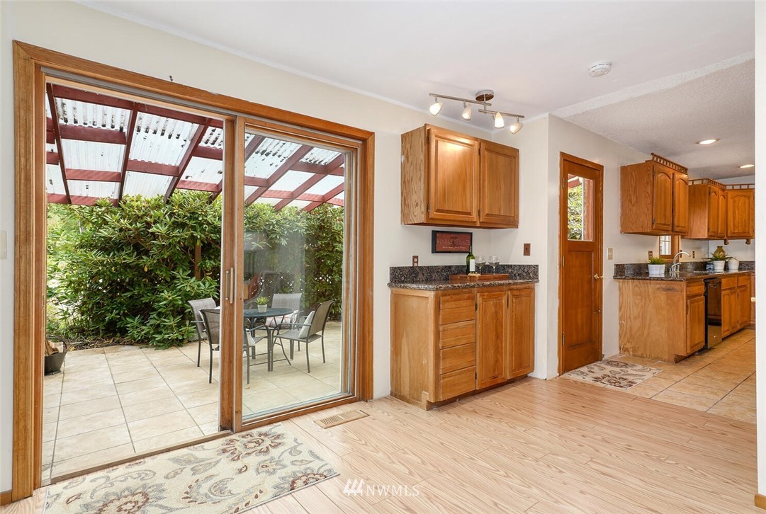 17002 Southeast 128th Street Renton, WA 98059 - Photo 17 of 30 a view of kitchen with furniture and large window