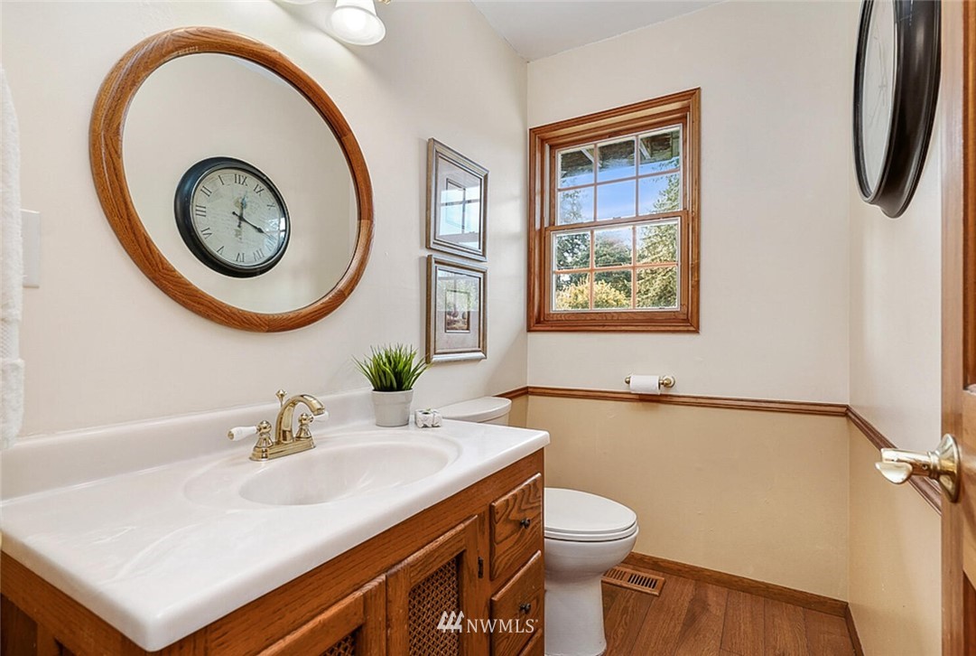 17002 Southeast 128th Street Renton, WA 98059 - Photo 18 of 30 a bathroom with a sink and a mirror