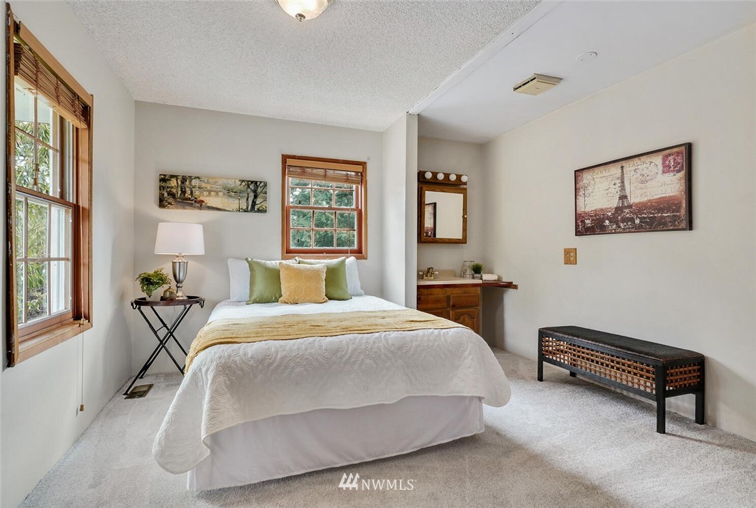 17002 Southeast 128th Street Renton, WA 98059 - Photo 19 of 30 a bedroom with a bed wall painting and a window