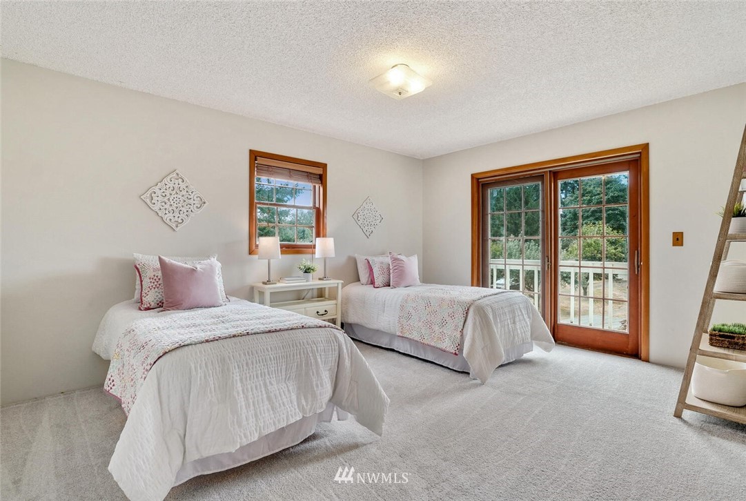 17002 Southeast 128th Street Renton, WA 98059 - Photo 20 of 30 a bedroom with bed and a large window
