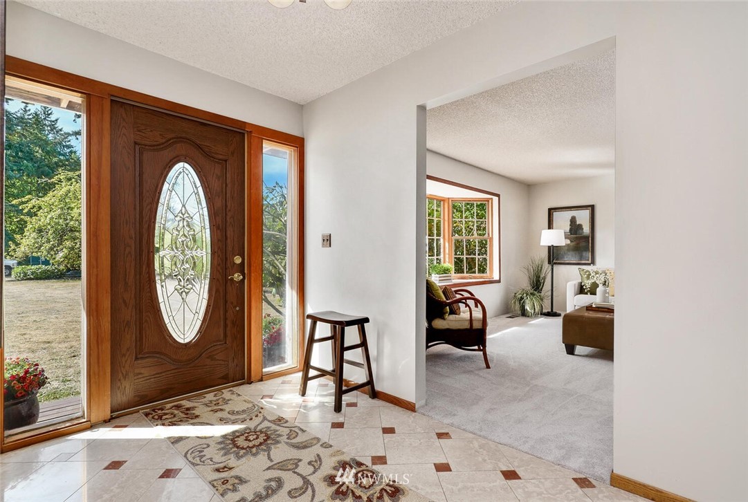 17002 Southeast 128th Street Renton, WA 98059 - Photo 3 of 30 a living room with furniture a window and a potted plant