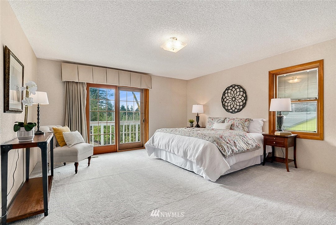 17002 Southeast 128th Street Renton, WA 98059 - Photo 23 of 30 a spacious bedroom with a bed and a large window