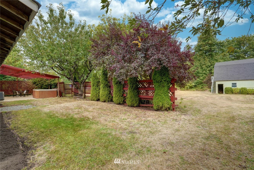 17002 Southeast 128th Street Renton, WA 98059 - Photo 27 of 30 a view of a house with a yard and garage
