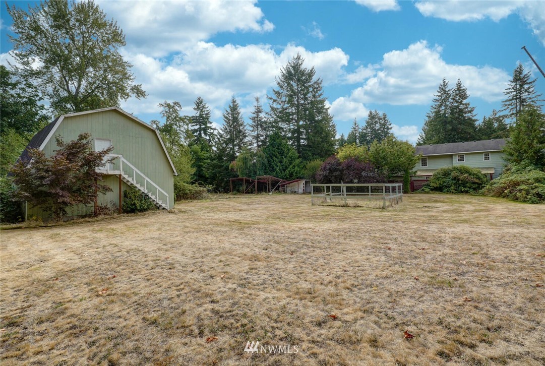 17002 Southeast 128th Street Renton, WA 98059 - Photo 29 of 30 a backyard of a house with lots of green space