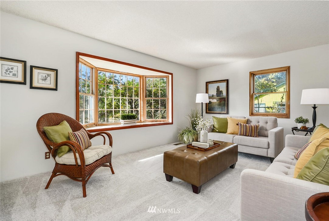 17002 Southeast 128th Street Renton, WA 98059 - Photo 4 of 30 a living room with furniture and a window