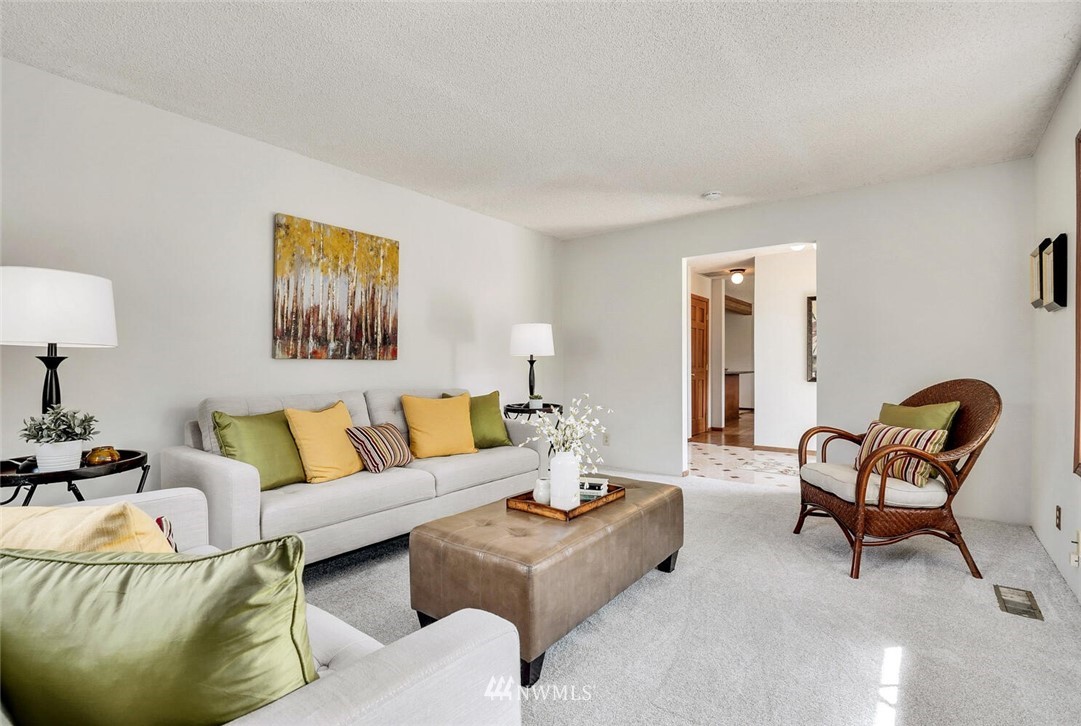 17002 Southeast 128th Street Renton, WA 98059 - Photo 5 of 30 a living room with furniture and a lamp