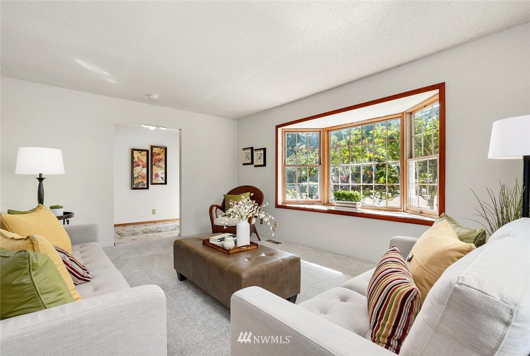17002 Southeast 128th Street Renton, WA 98059 - Photo 6 of 30 a living room with furniture and a large window