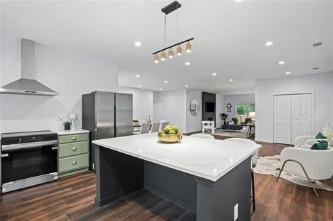 a kitchen with sink cabinets and stainless steel appliances