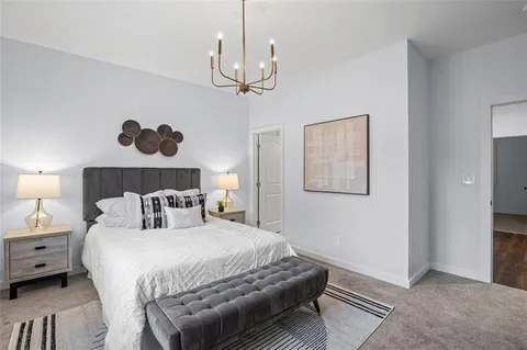 a bedroom with bed and window