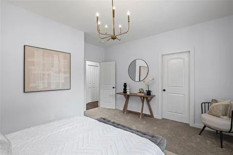 a bedroom with bed furniture and a window