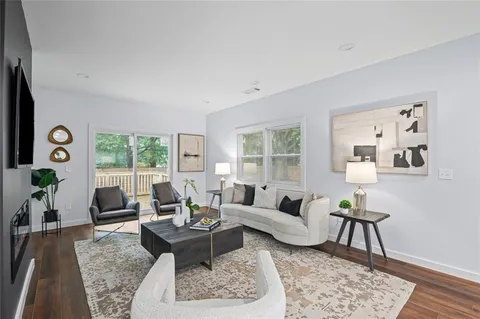 a living room with furniture and a table