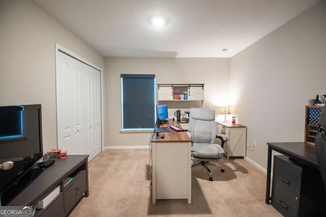 a room with furniture and a flat screen tv