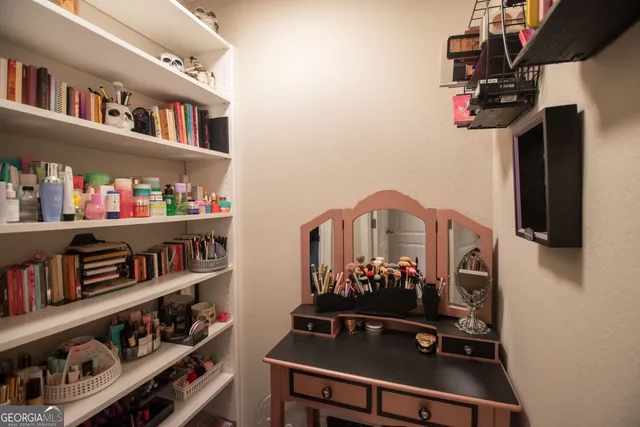 a view of a workspace with bookshelf