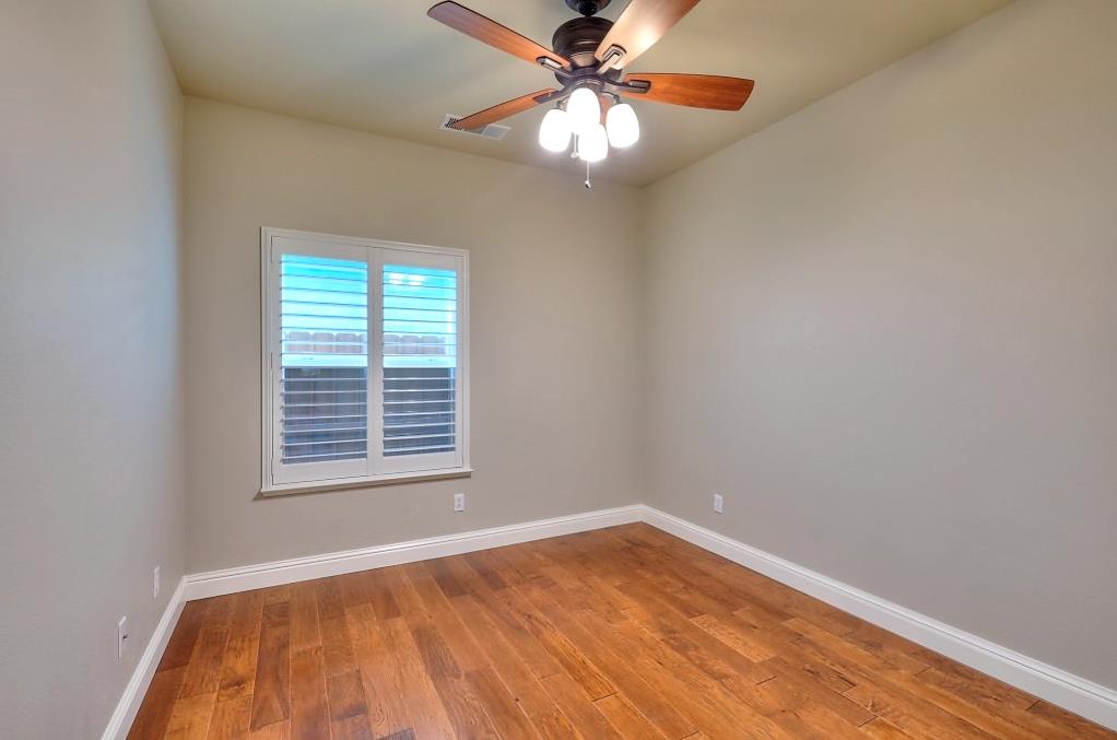 4152 Post Oak Drive Turlock, CA 95382 - Photo 42 of 71 wooden floor in an empty room with a window