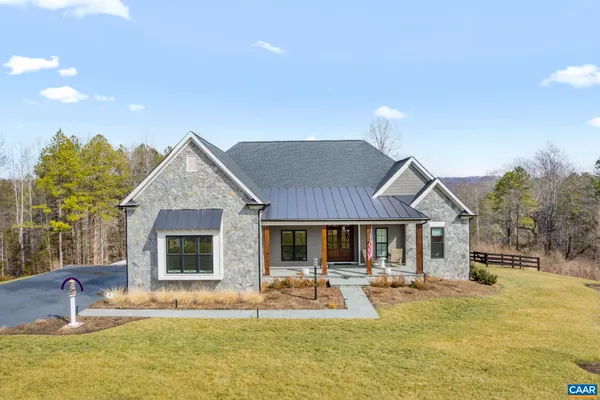 a house view with swimming pool and porch