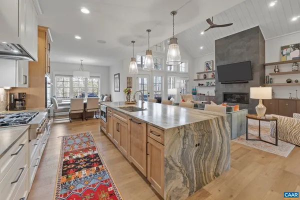 a large kitchen with lots of counter space and windows