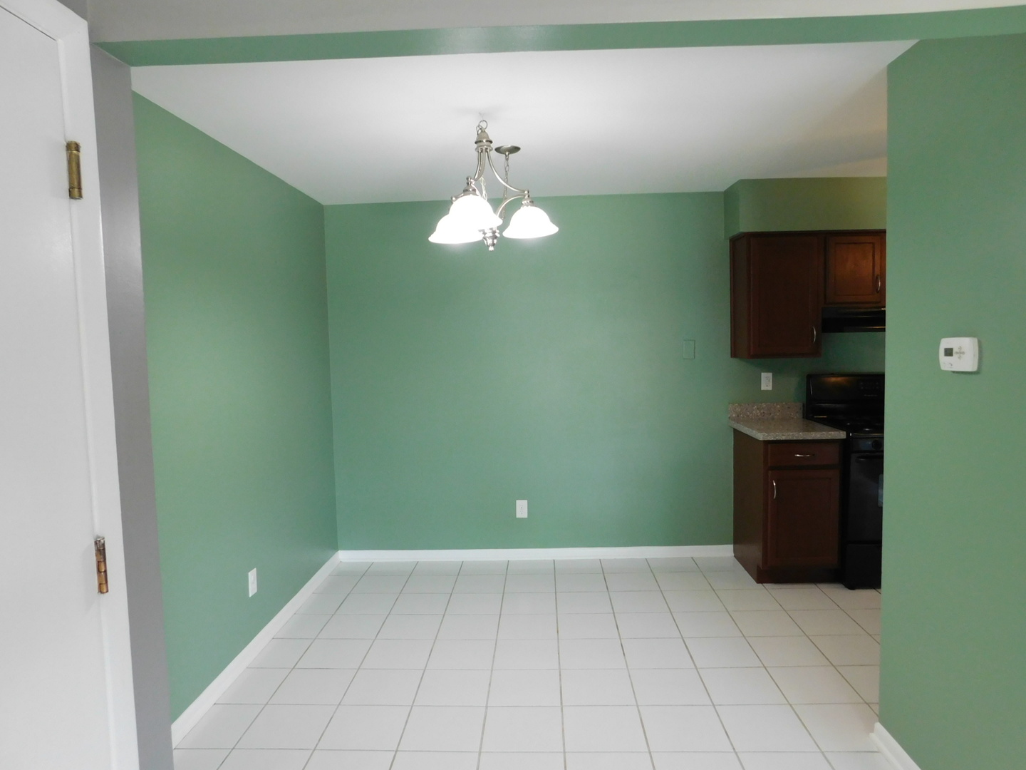 19398 Wolf Road, Unit 8 Mokena, IL 60448 - Photo 4 of 9 a kitchen with a refrigerator and a stove