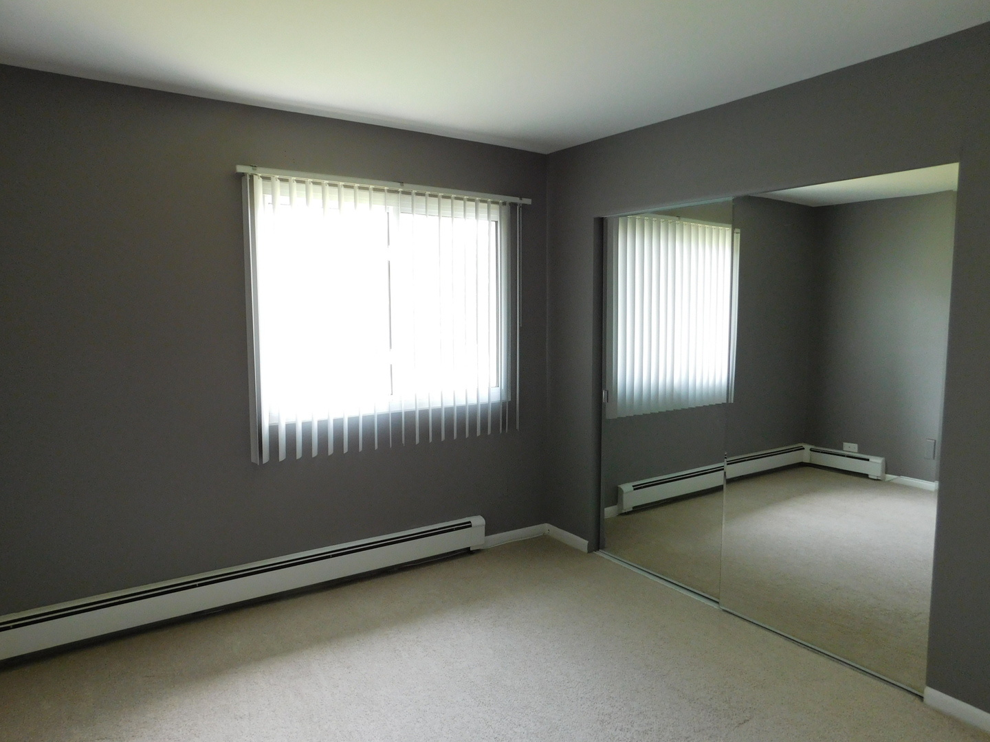 19398 Wolf Road, Unit 8 Mokena, IL 60448 - Photo 7 of 9 an empty room with a window