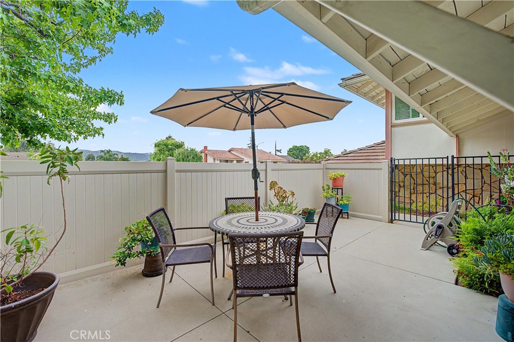 22671 Town Crier Road Calabasas, CA 91302 - Photo 5 of 35 a view of a chairs and table in the patio