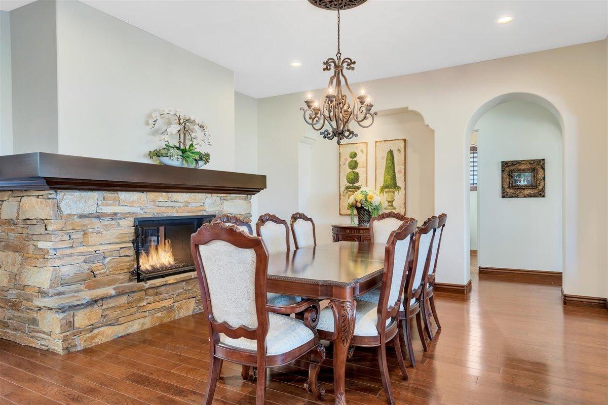 58445 Carmona La Quinta, CA 92253 - Photo 18 of 70 a view of a dining room with furniture wooden floor and chandelier