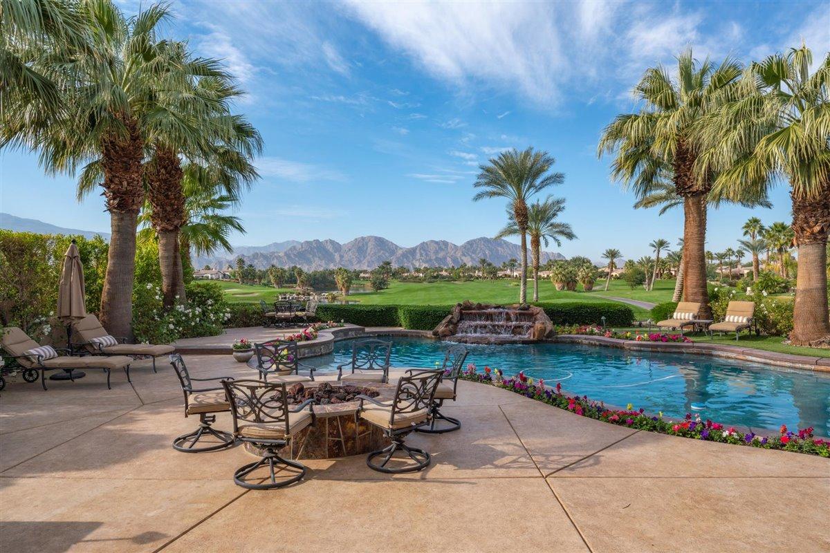 58445 Carmona La Quinta, CA 92253 - Photo 2 of 70 a view of a lake with a table and chairs