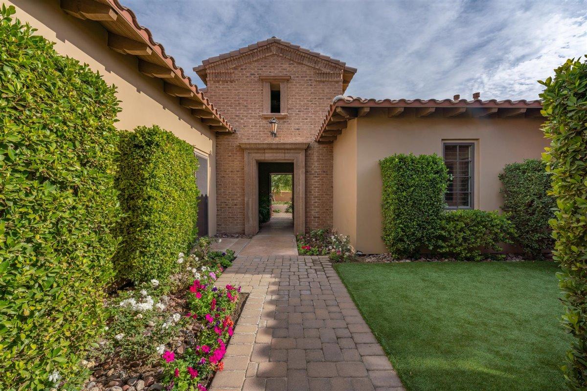 58445 Carmona La Quinta, CA 92253 - Photo 29 of 70 a front view of a house with a yard