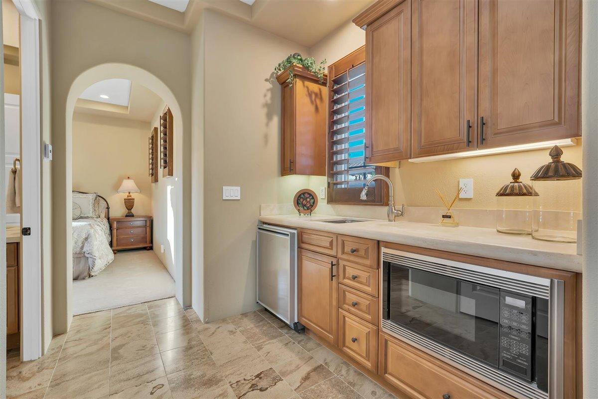 58445 Carmona La Quinta, CA 92253 - Photo 32 of 70 a en suite bathroom with a sink and a mirror