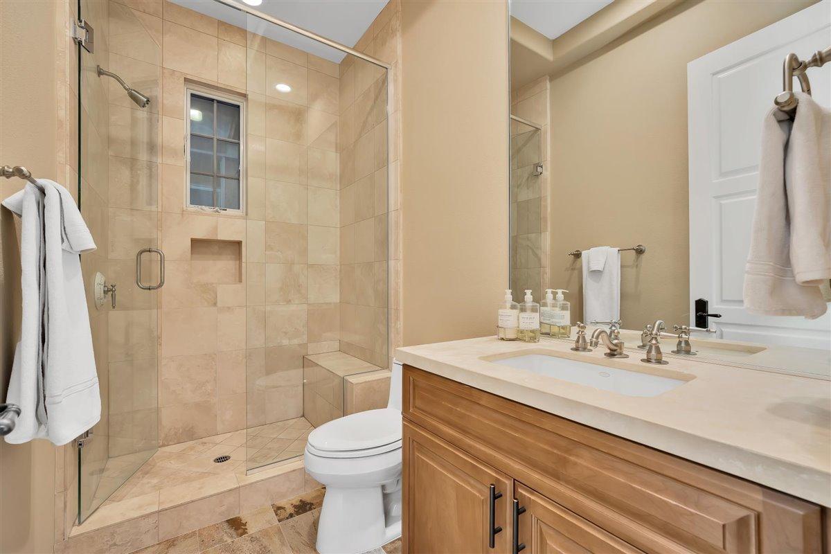 58445 Carmona La Quinta, CA 92253 - Photo 34 of 70 a bathroom with a sink a toilet and shower