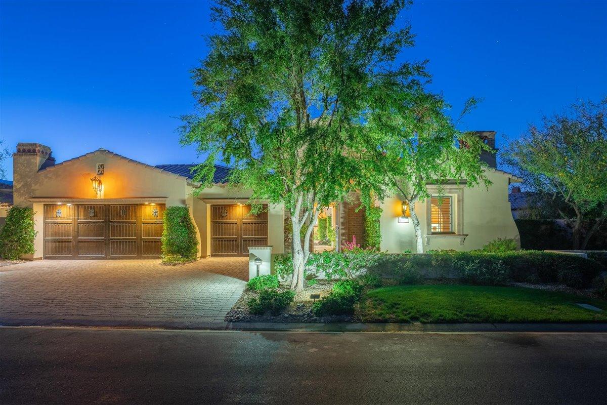 58445 Carmona La Quinta, CA 92253 - Photo 48 of 70 a front view of a house with a yard and a garage