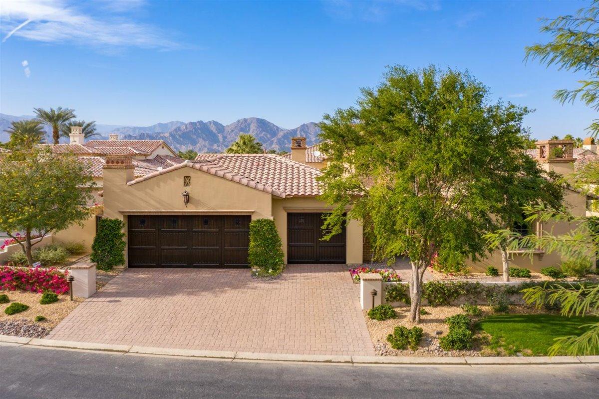 58445 Carmona La Quinta, CA 92253 - Photo 7 of 70 front view of a house with a garden