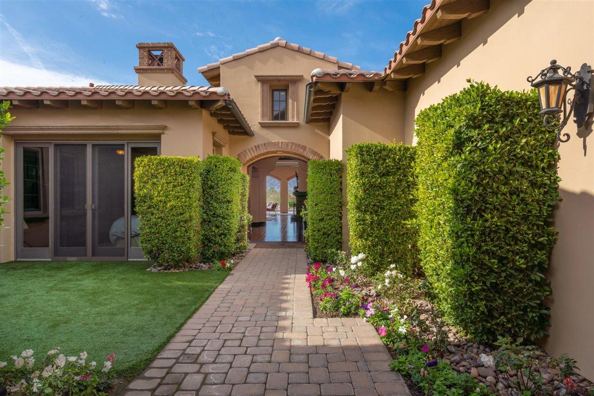 58445 Carmona La Quinta, CA 92253 - Photo 8 of 70 a front view of a house with a garden
