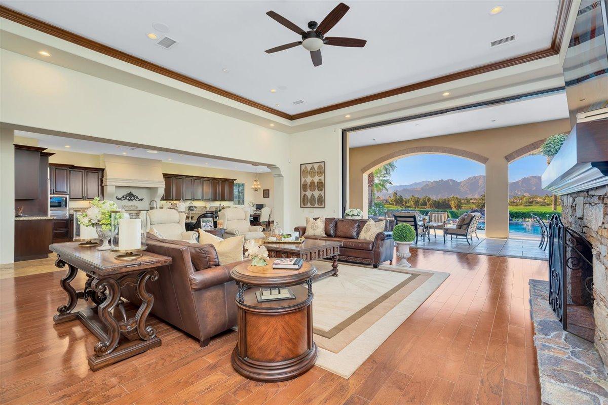 58445 Carmona La Quinta, CA 92253 - Photo 10 of 70 a living room with fireplace furniture and a large window