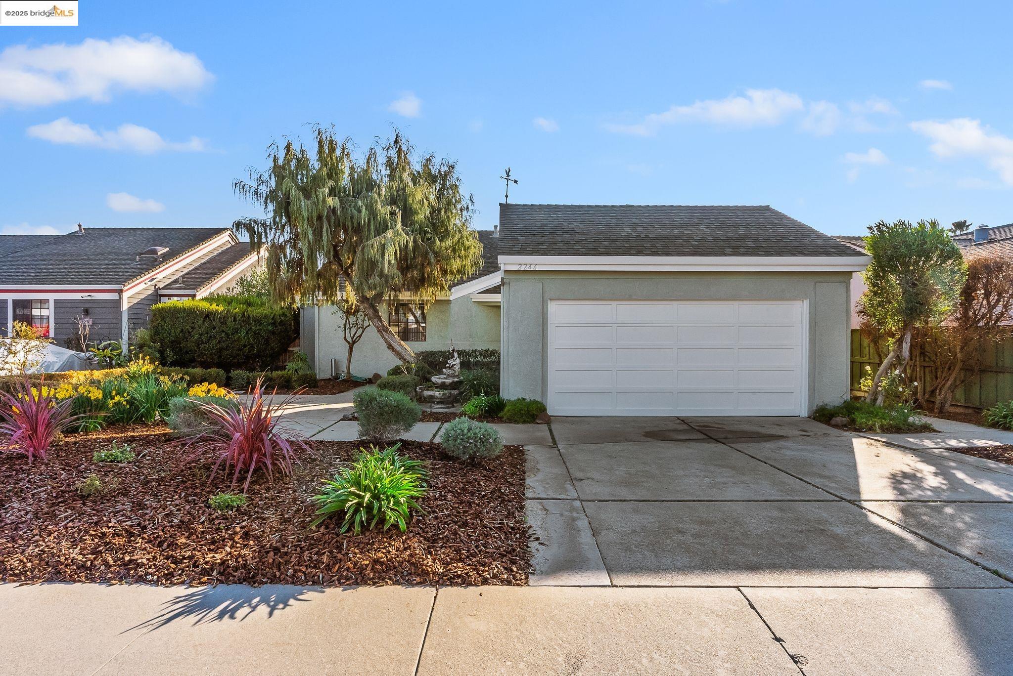 2246 Sand Point Road Discovery Bay, CA 94505 - Photo 1 of 1 a front view of a house with a yard