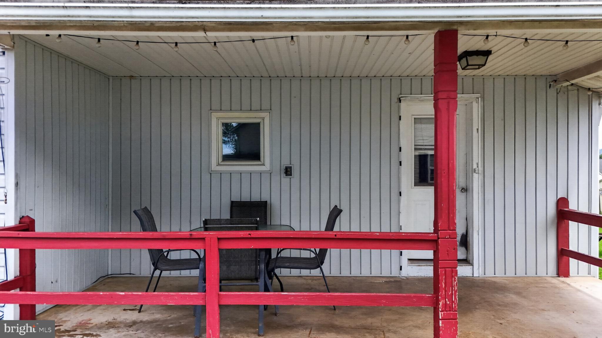 14 North Kinzer Road Kinzers, PA 17535 - Photo 19 of 34 Charming porch with vibrant red accents.