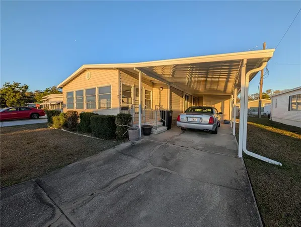 a view of a car park in front of house