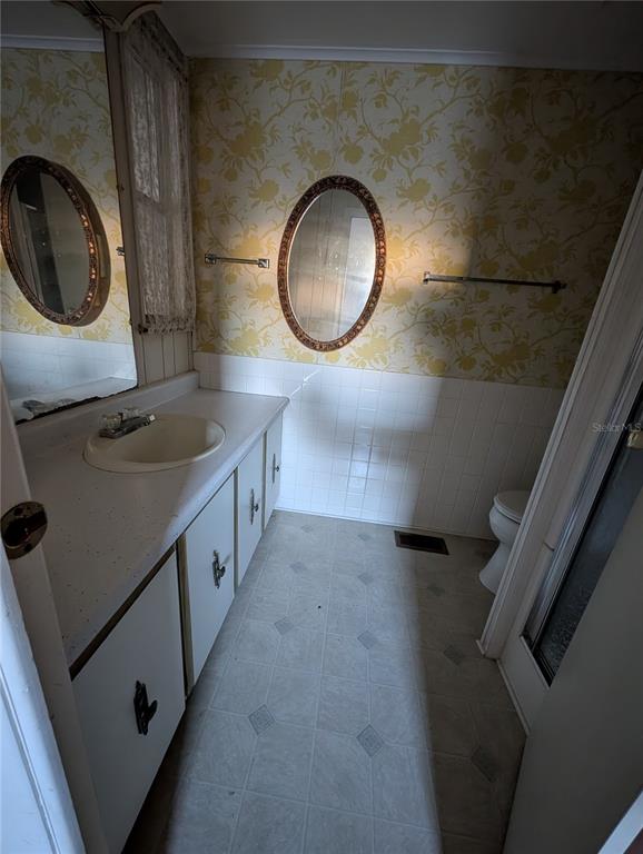 1102 46th Avenue East Ellenton, FL 34222 - Photo 13 of 15 a bathroom with a granite countertop sink and a mirror