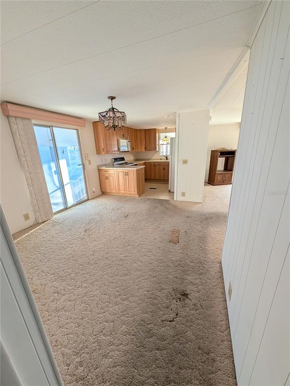 1102 46th Avenue East Ellenton, FL 34222 - Photo 4 of 15 a view of kitchen with furniture and wooden floor