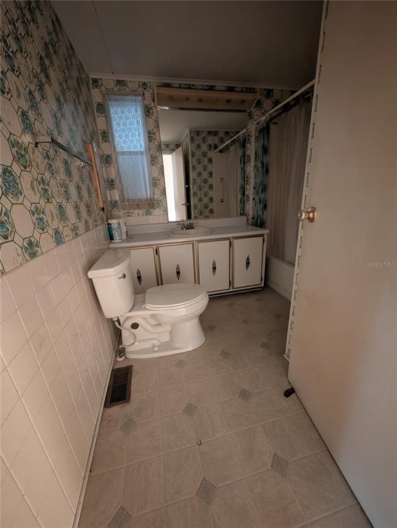 1102 46th Avenue East Ellenton, FL 34222 - Photo 10 of 15 a bathroom with a tub sink and mirror