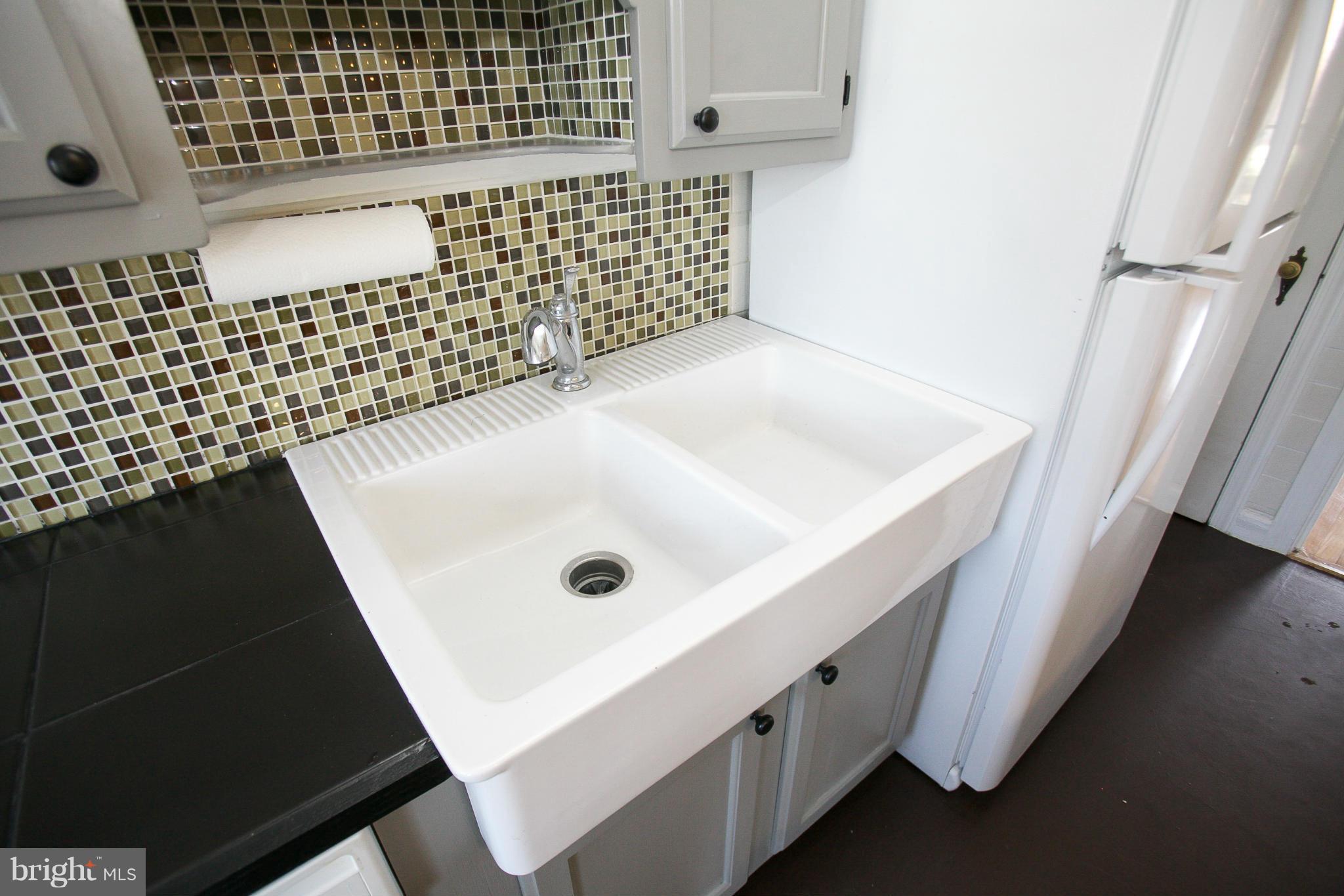 3802 Yolando Road Baltimore, MD 21218 - Photo 23 of 27 a bathroom with a sink and a shower
