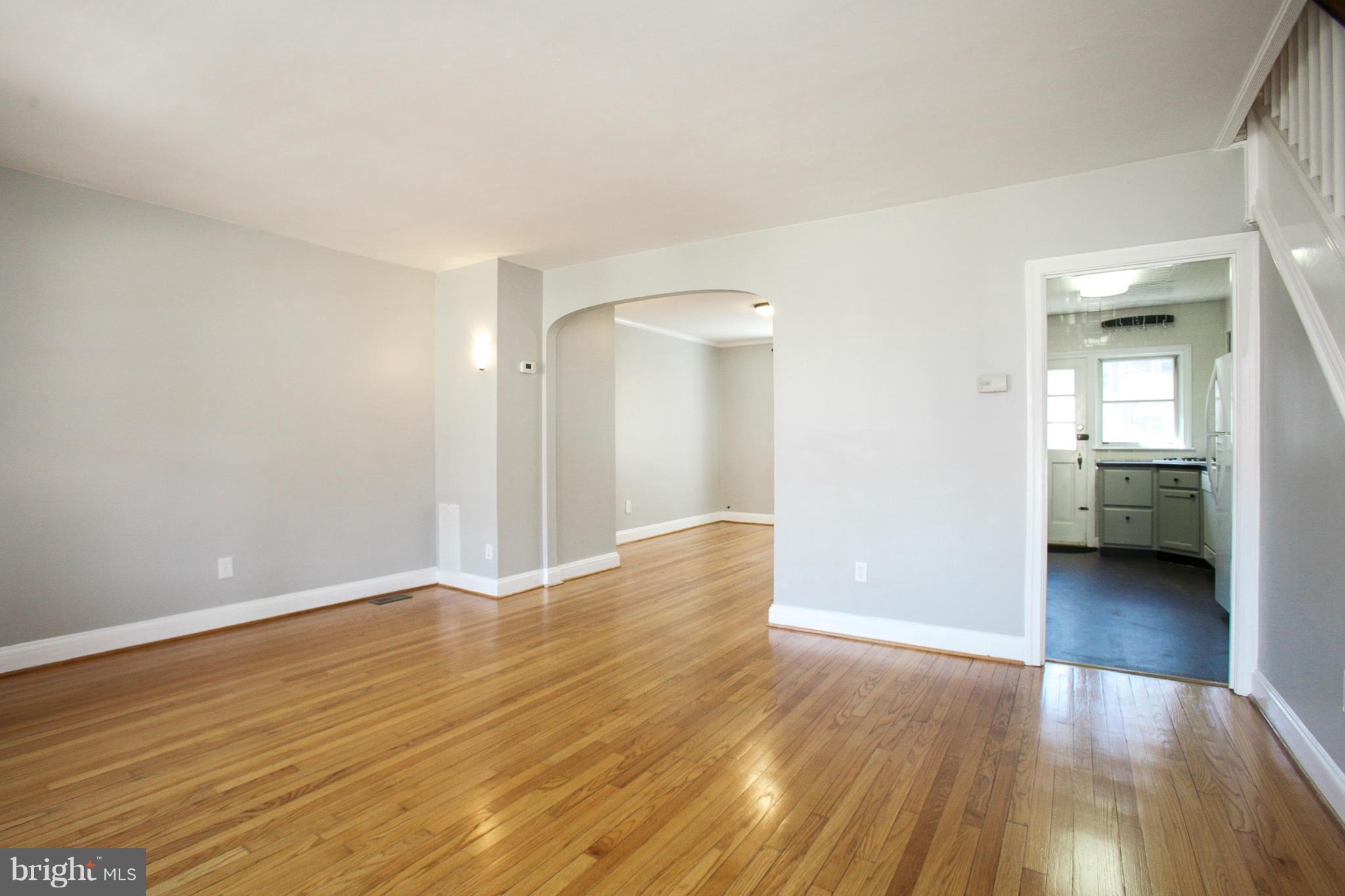 3802 Yolando Road Baltimore, MD 21218 - Photo 5 of 27 a view of a room with wooden floor and a bathroom