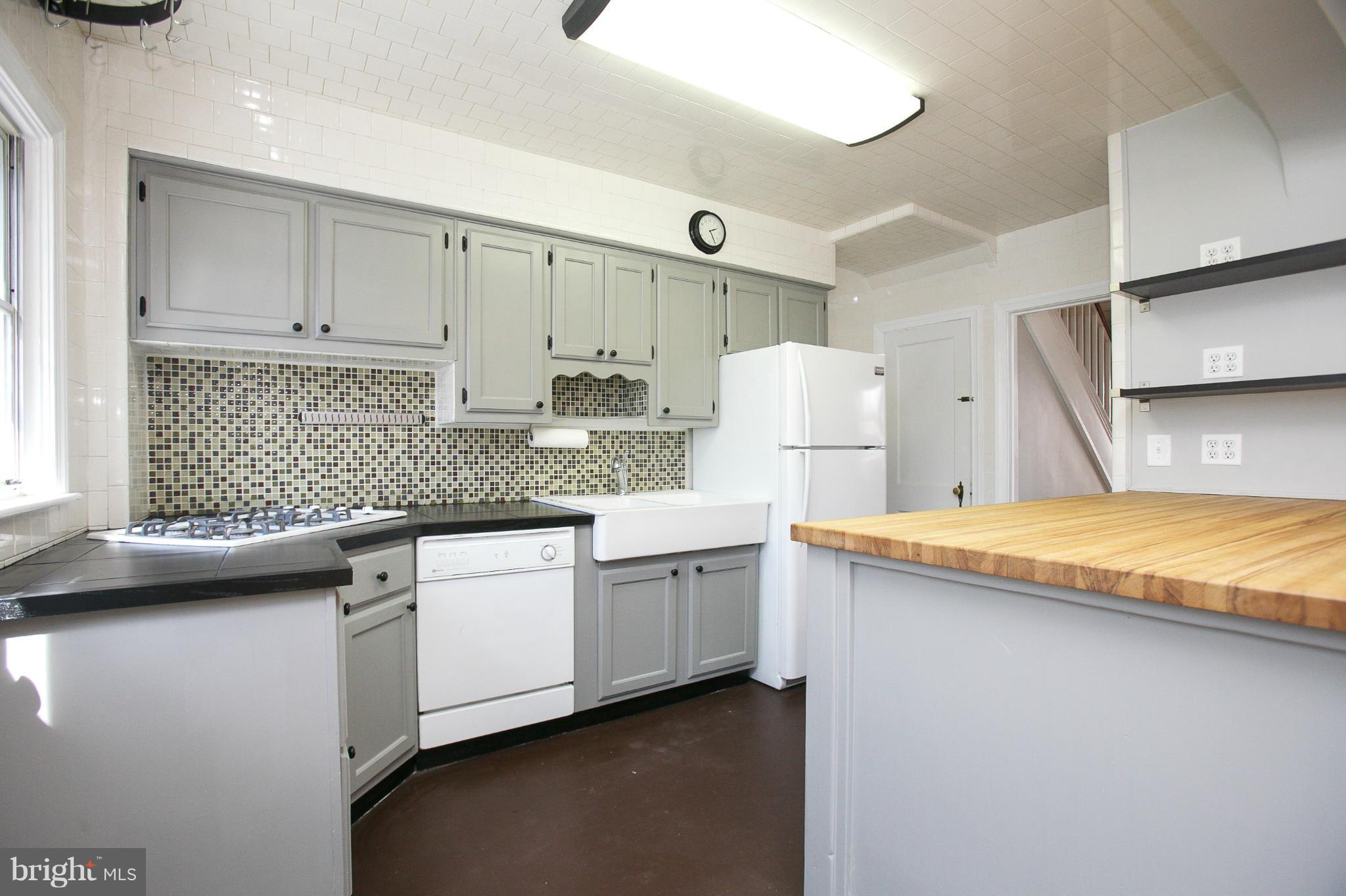 3802 Yolando Road Baltimore, MD 21218 - Photo 8 of 27 a kitchen with stainless steel appliances granite countertop a sink stove and cabinets