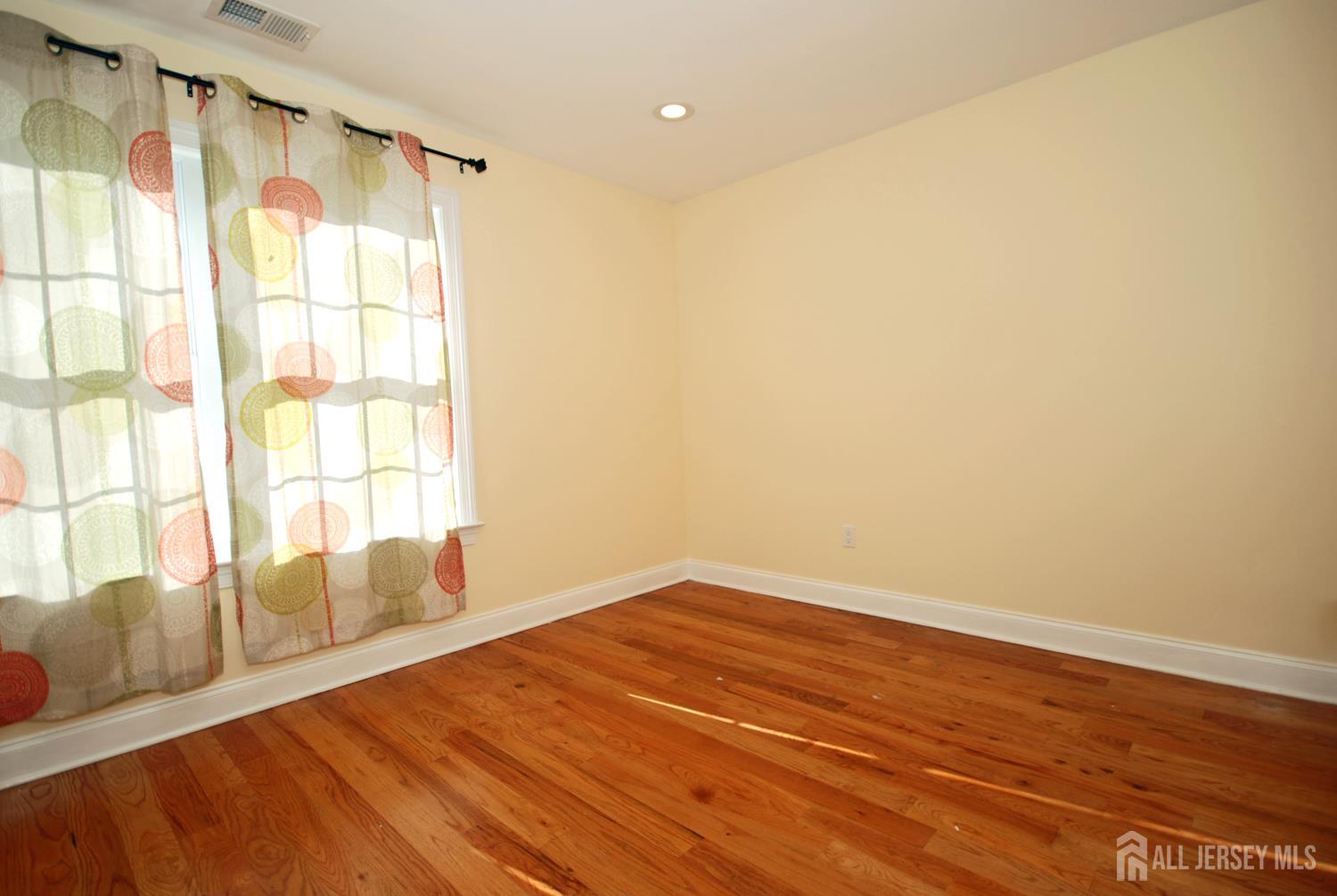32 Cinder Road, Unit 3 Edison, NJ 08820 - Photo 15 of 34 a view of an empty room with a window