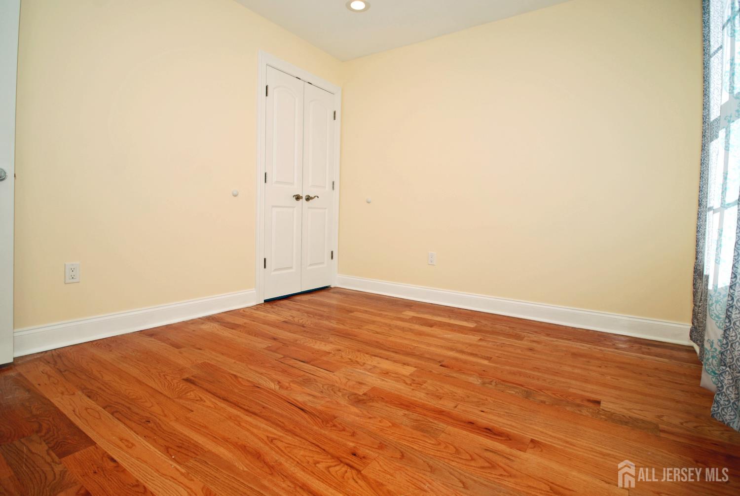 32 Cinder Road, Unit 3 Edison, NJ 08820 - Photo 18 of 34 a view of empty room with wooden floor