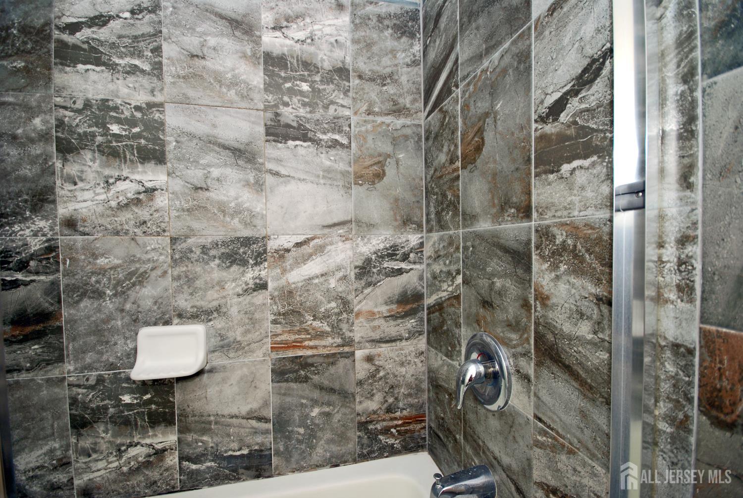 32 Cinder Road, Unit 3 Edison, NJ 08820 - Photo 23 of 34 a bathroom with a shower