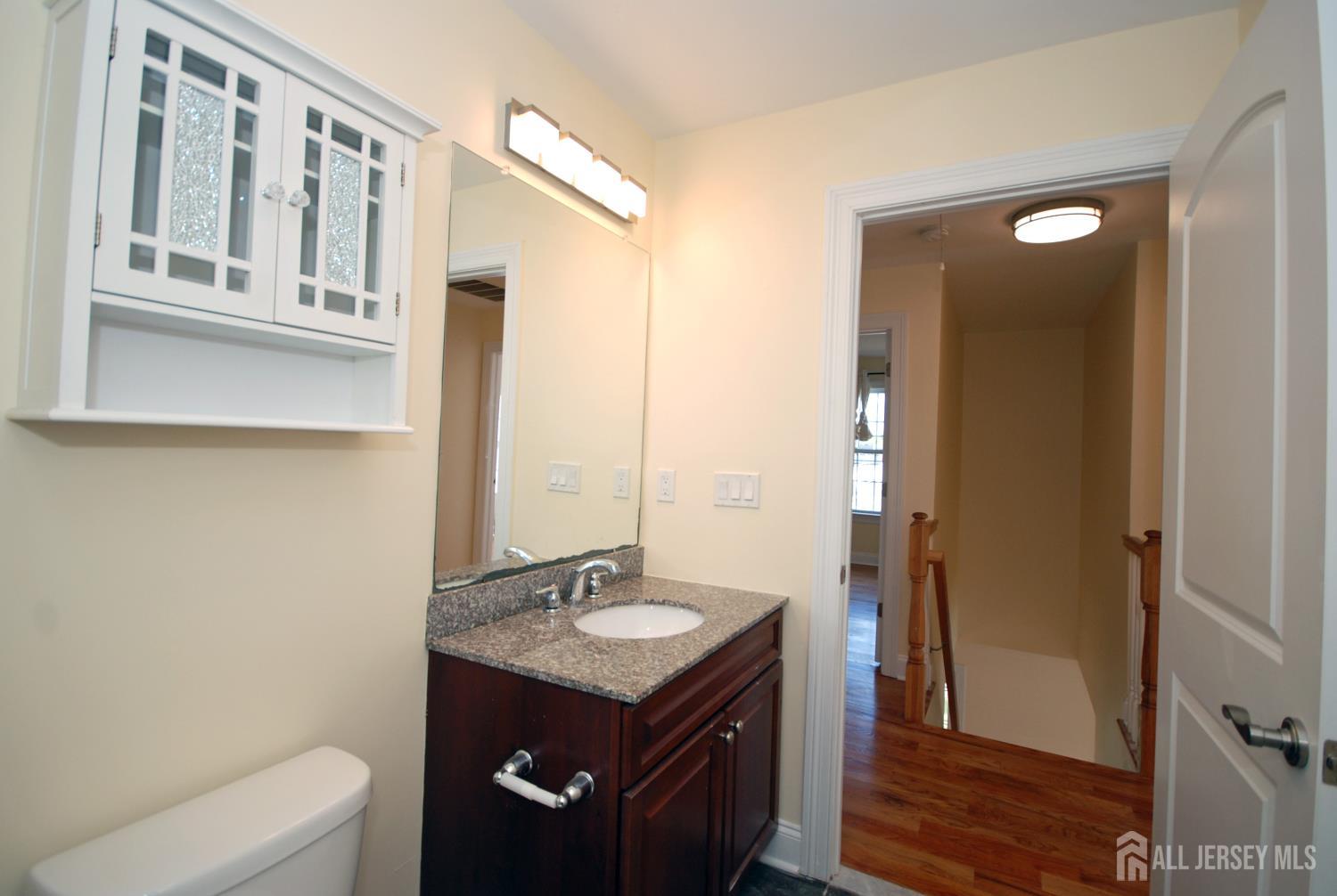 32 Cinder Road, Unit 3 Edison, NJ 08820 - Photo 29 of 34 a bathroom with a sink a toilet and shower