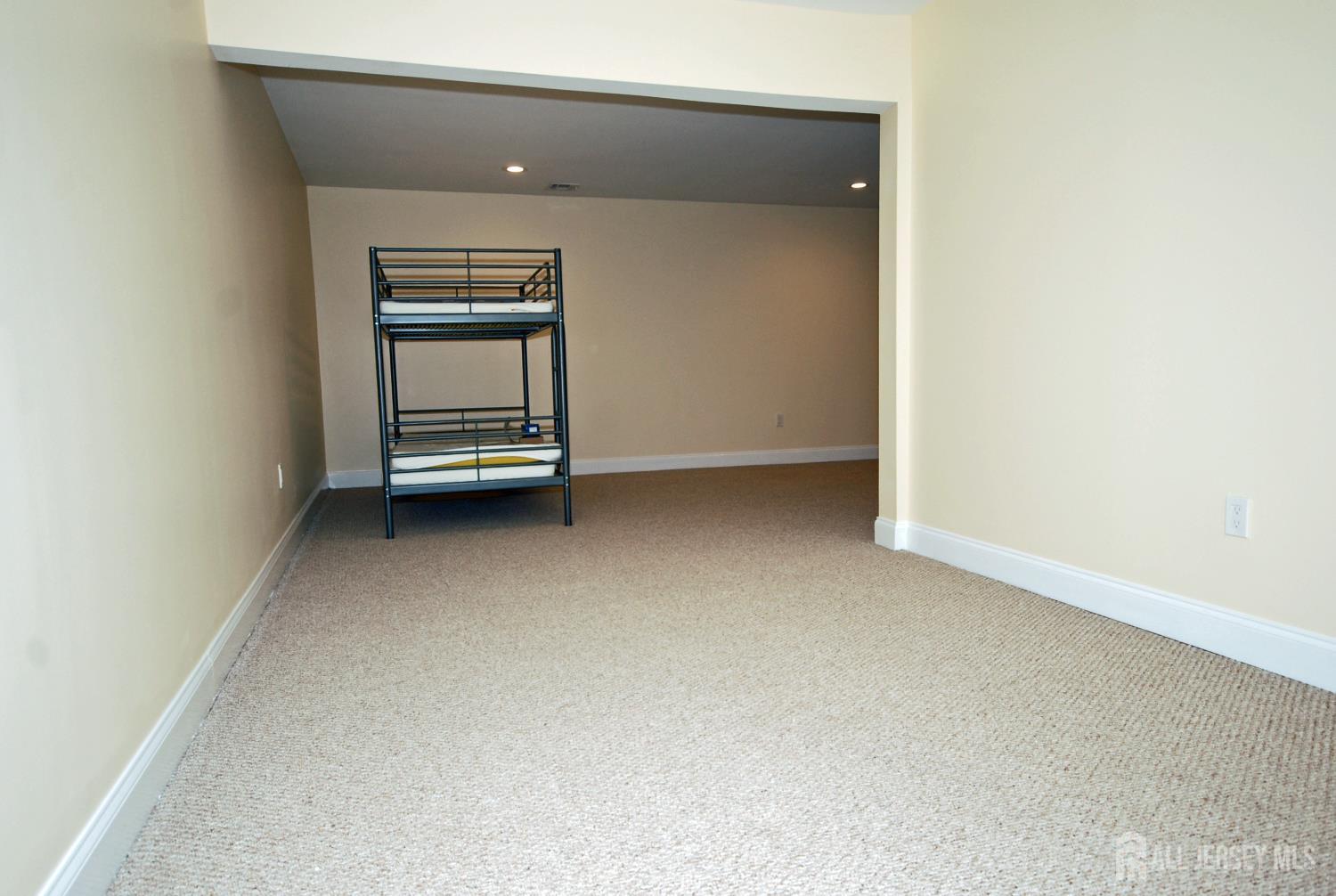 32 Cinder Road, Unit 3 Edison, NJ 08820 - Photo 32 of 34 a view of an empty room and kitchen