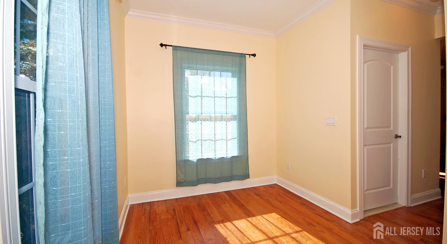 32 Cinder Road, Unit 3 Edison, NJ 08820 - Photo 4 of 34 a view of a room with window and wooden floor