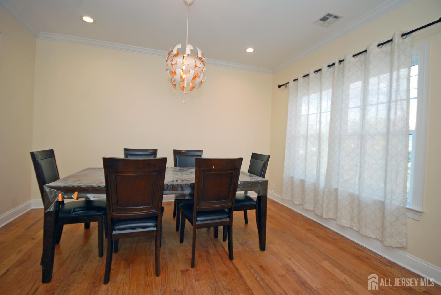 32 Cinder Road, Unit 3 Edison, NJ 08820 - Photo 5 of 34 a view of a dining room with furniture window and wooden floor