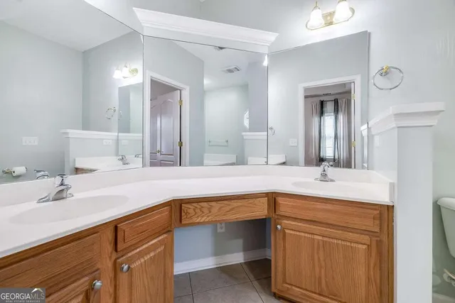 a bathroom with a bathtub and a window