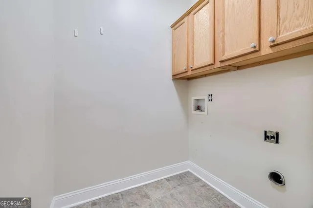 a view of a livingroom with furniture and a grill